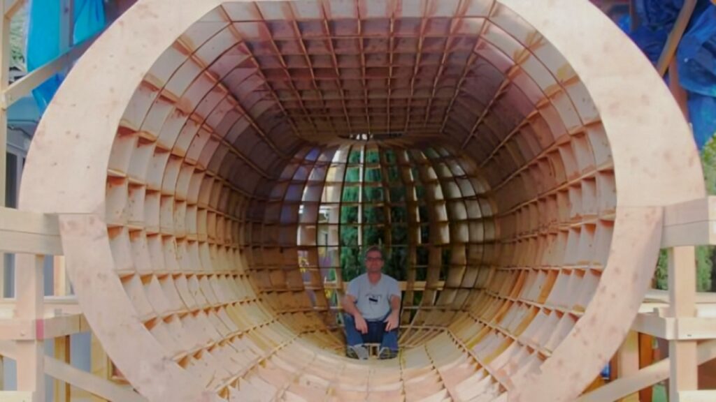 Chrish Robinson is seated on Tsunamiproof ball