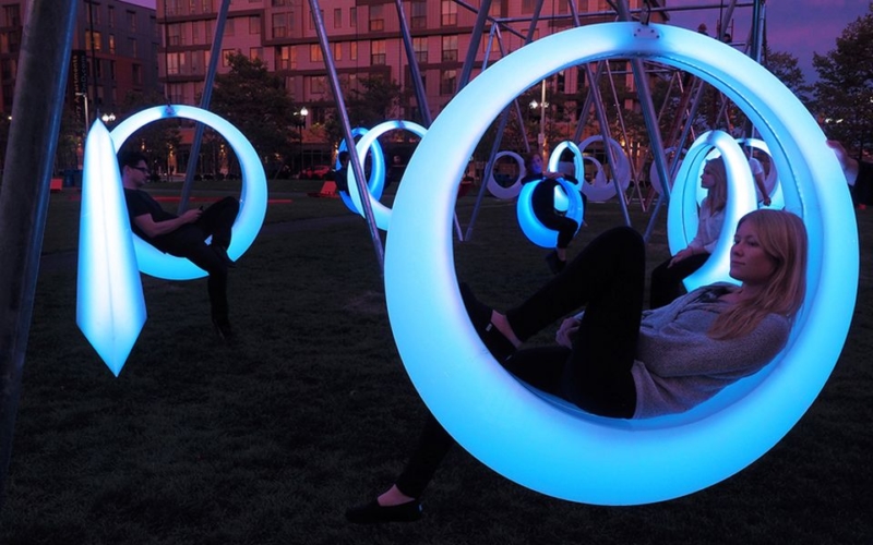 Swing Time Color changing illuminated ringshaped swings in Boston