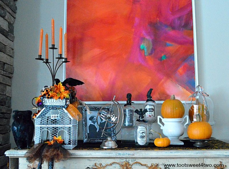 Add pumpkins on a shelf in living room 