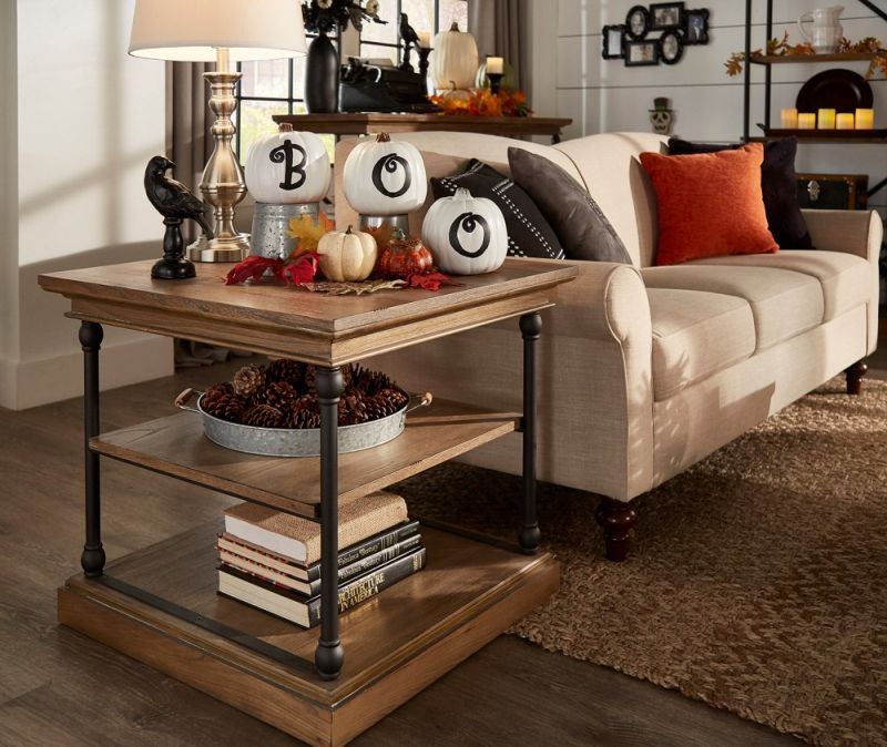 Add pumpkins on a side table in living room 