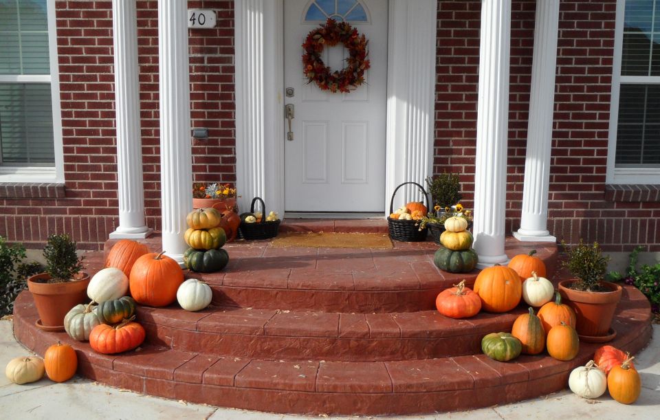 Decorate front porch with pumpkins for Halloween