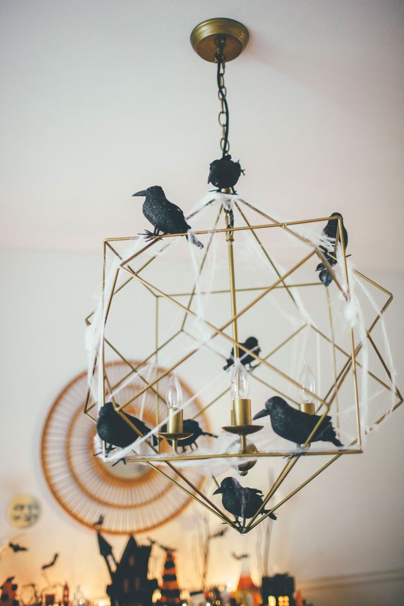 crows and spider web on a chandelier 