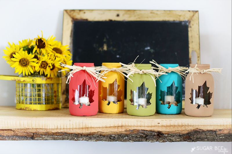 Painted mason jars with ribbon on top