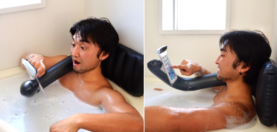 Handy bath pillow doubles as a smartphone holder, might also be giving you  a hug