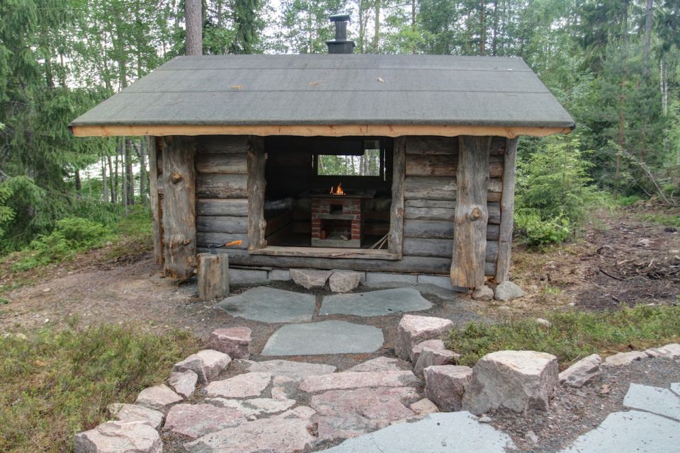 Hand-carved grill hut located in the backyard