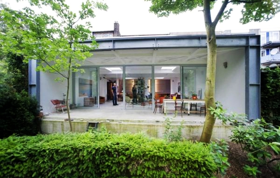 Ambulance garage turned into modern home with orange interior