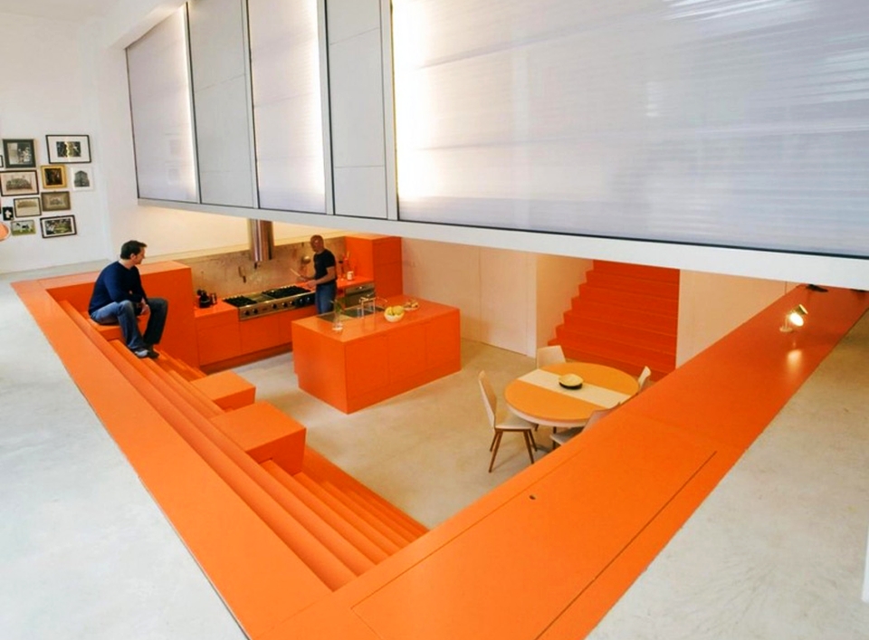 Ambulance garage turned into modern home with orange interior