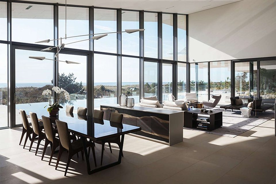 The living, dining an kitchen area provides the beautiful view of the ocean