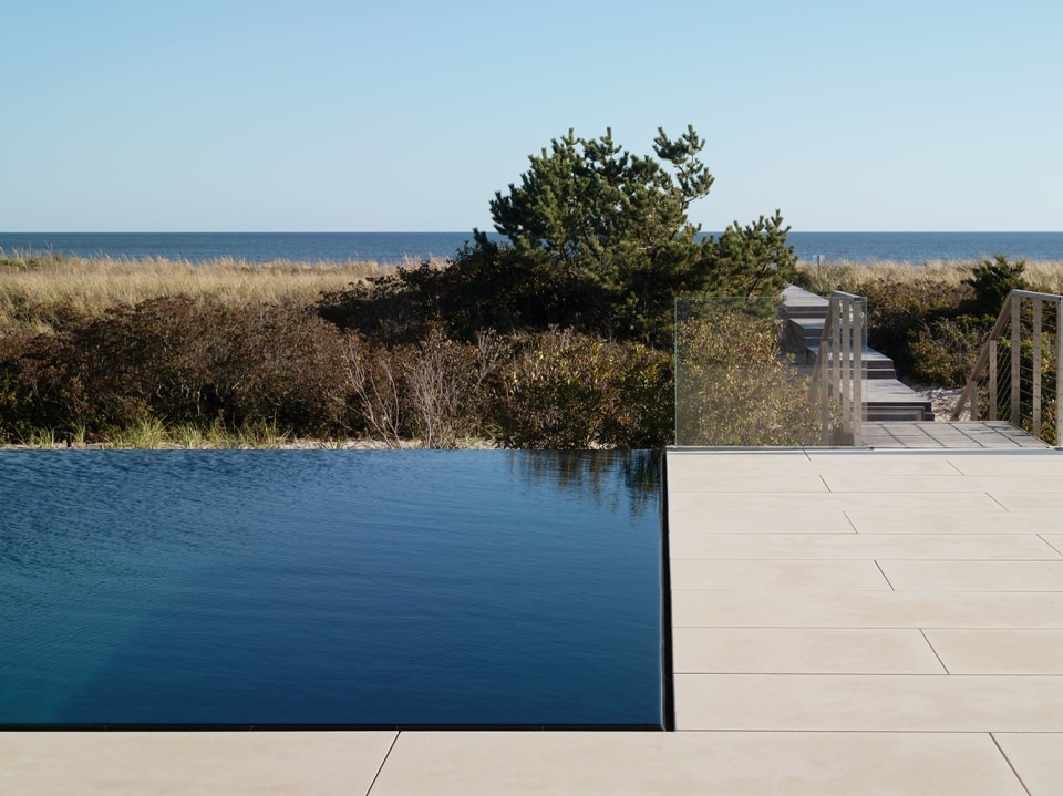 deck for sunbathing and infinity pool to enjoy the view of far-off ocean