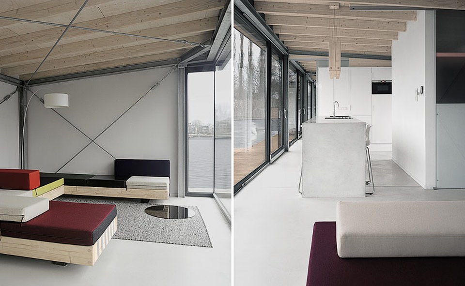 Custom-made minimalist interiors add simplicity and modernity to the houseboat