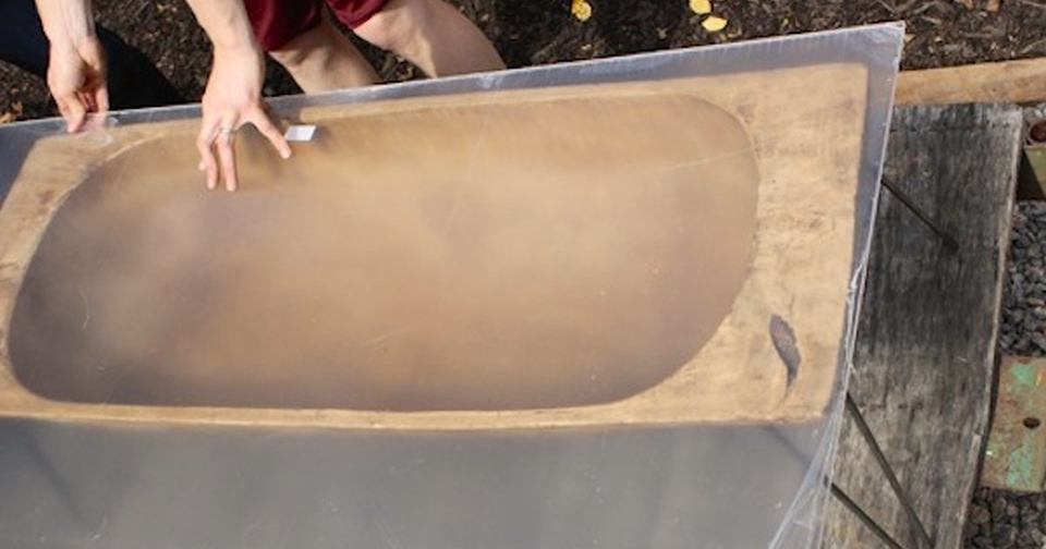 Antique dough bowl into chic coffee table