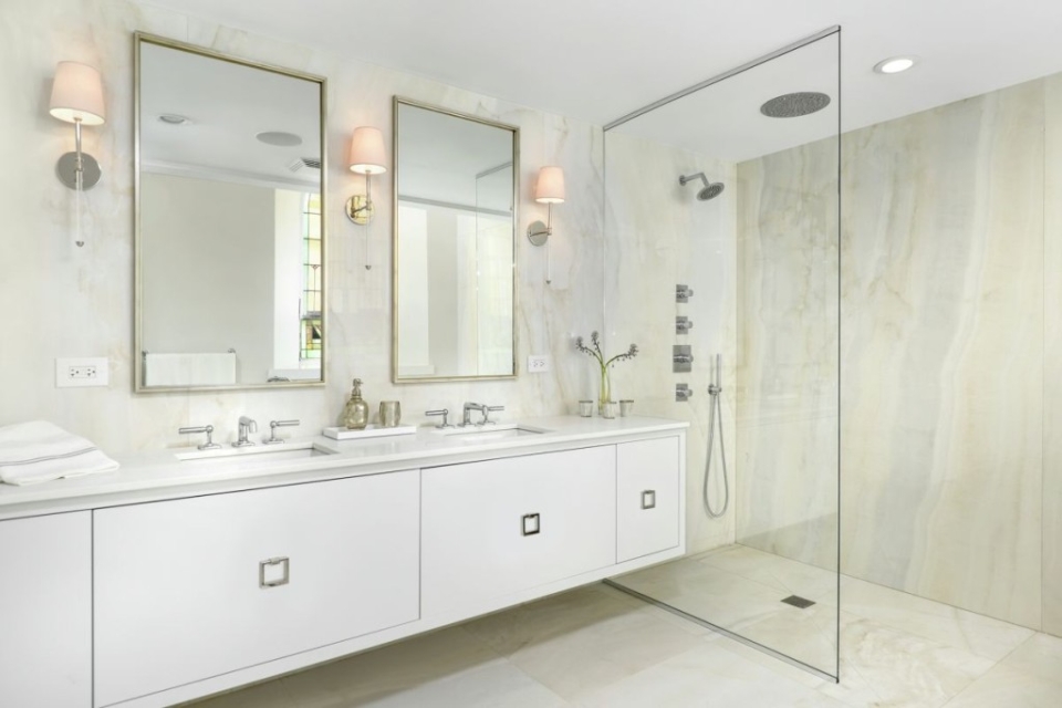 Spacious bathroom with patterned floors and various fixtures