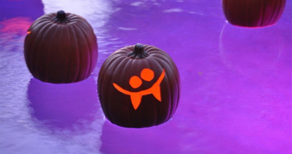 artificial Pumpkins with a spooky face Floating in a pool for halloween   