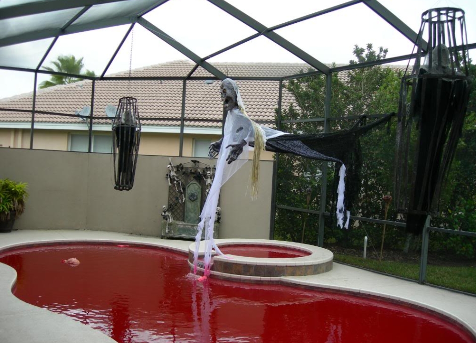 Ghosts and Trapped Goblins hanging over the pool for halloween 