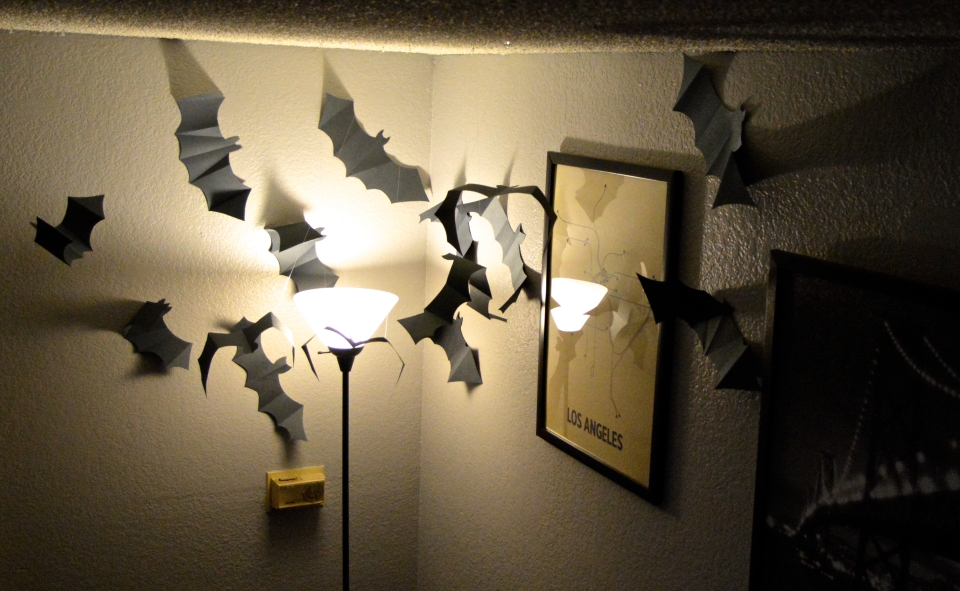 Paper Bat Swarm around a lamp 