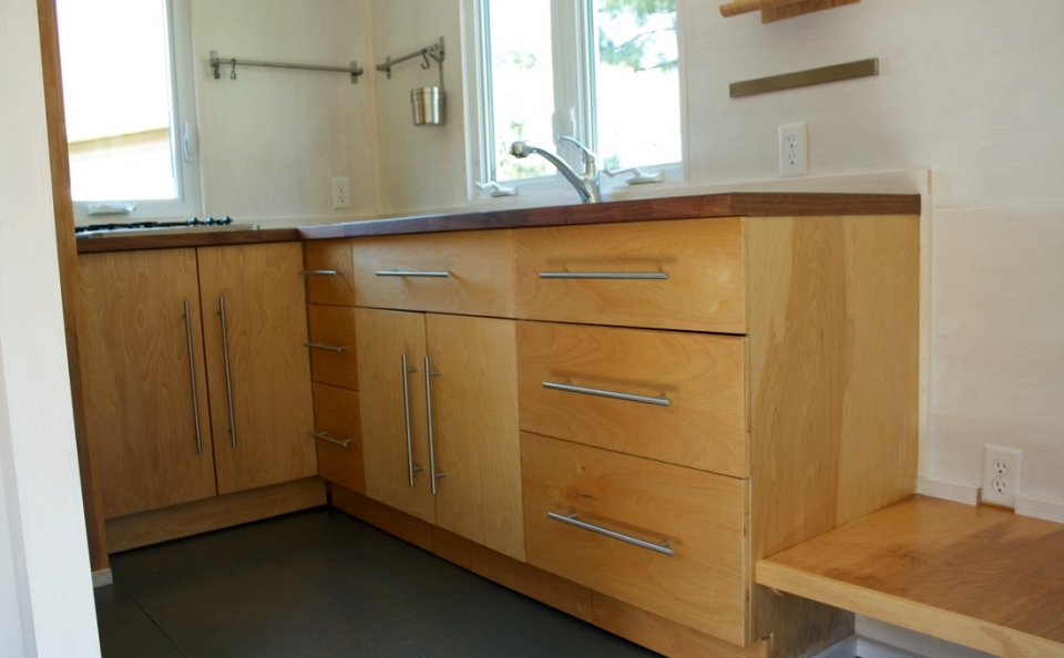 Full kitchen with propane burner cooktop and sink