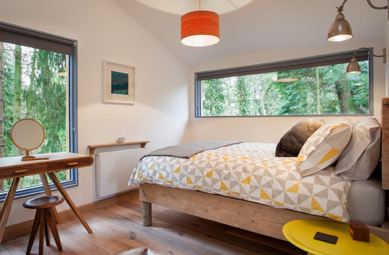 The bedroom with windows to offer view of surrounding areas