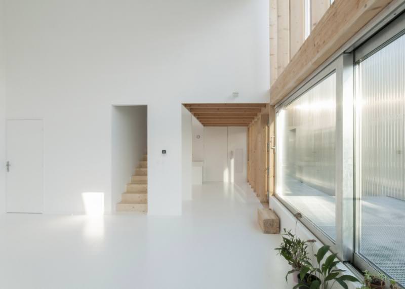  Large triple-glazed sliding doors and windows let in natural light