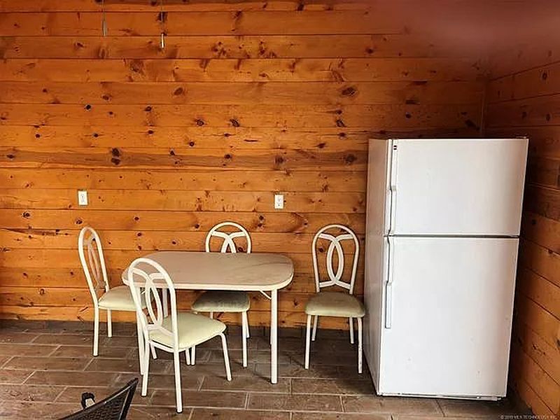 You can Buy this House with Fishing Hole in Living Room for $229K