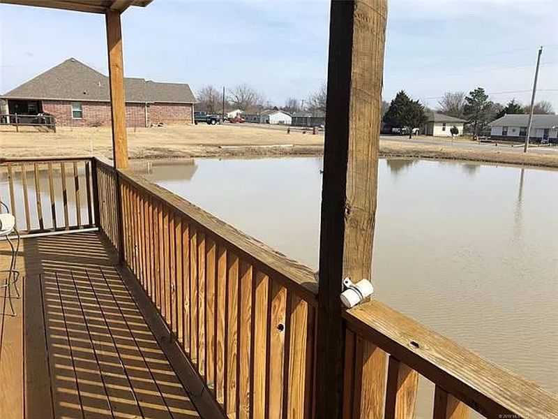 You can Buy this House with Fishing Hole in Living Room for $229K