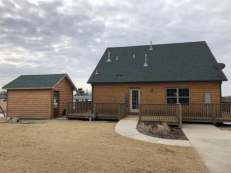 You can Buy this House with Fishing Hole in Living Room for $229K