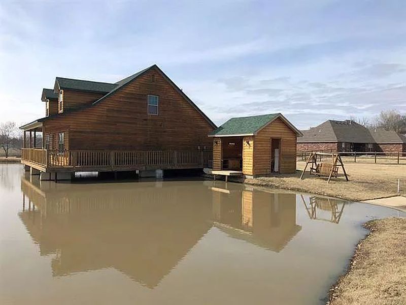 You can Buy this House with Fishing Hole in Living Room for $229K