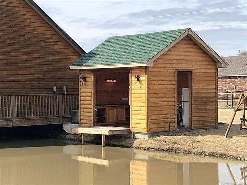 You can Buy this House with Fishing Hole in Living Room for $229K