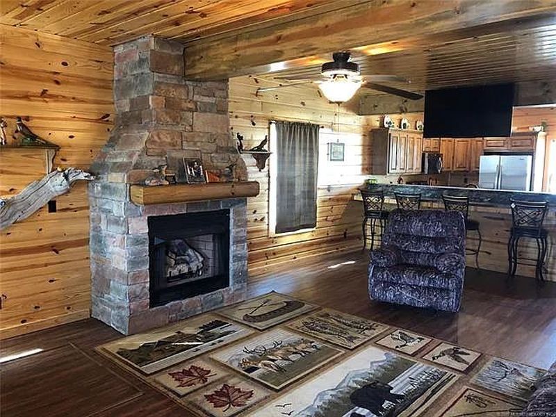 You can Buy this House with Fishing Hole in Living Room for $229K