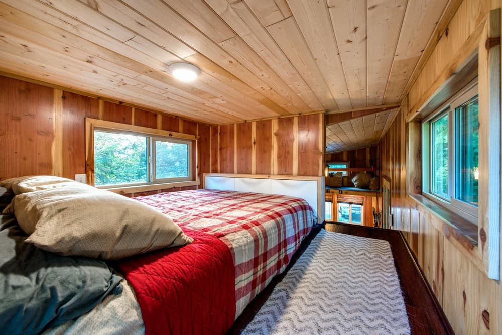 Exquisite bedroom with a wall-mounted TV