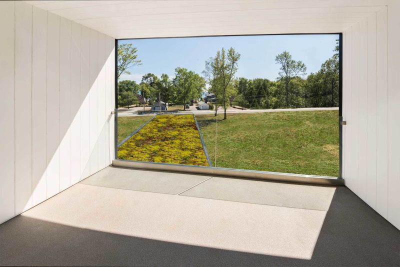 Master bedroom connected to covered balcony that offers views of the lake 