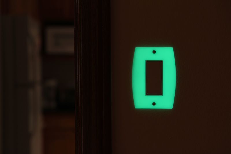 Translucent glowing switch plate with fire retardant foam shell inside 