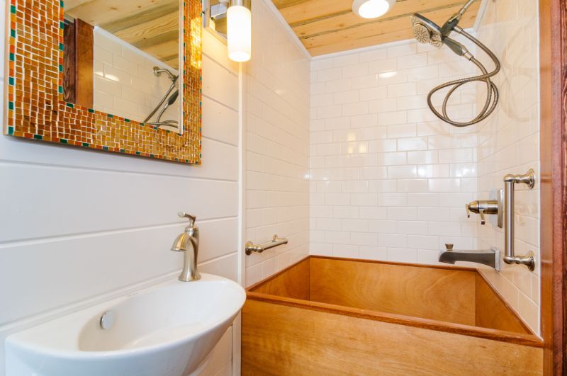 Tiled bathroom with Japanese soaking tub 