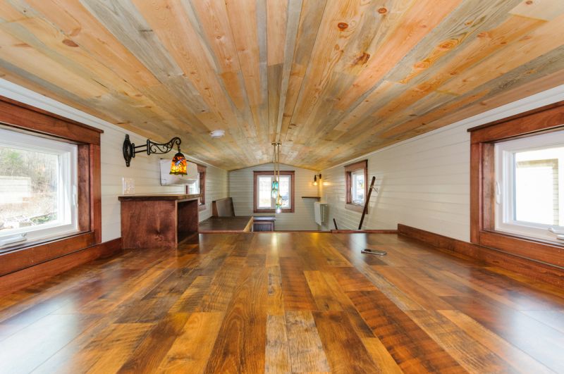 Loft bedroom with wooden texture ceiling 