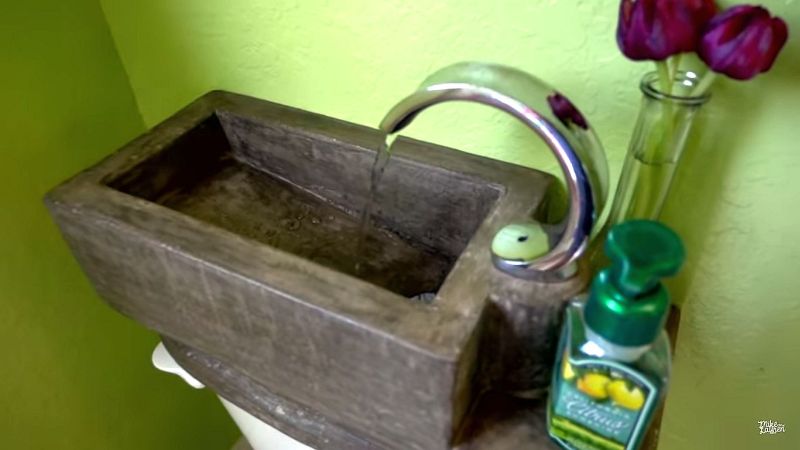 Utilize water at homes with DIY concrete toilet tank sink