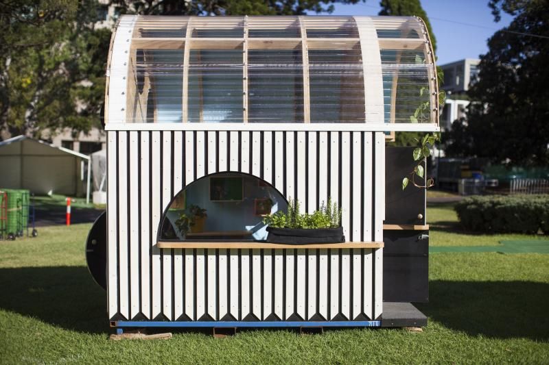 Modern Playhouse's exteriors designed with timber with black and white strips