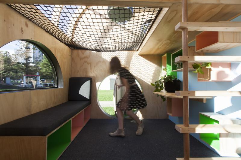 Comfortable bench and shelving inside the playhouse 