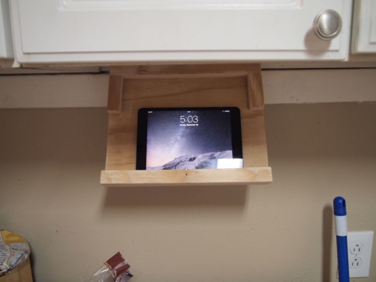 DIY iPad holder under kitchen keeps online recipes closeby