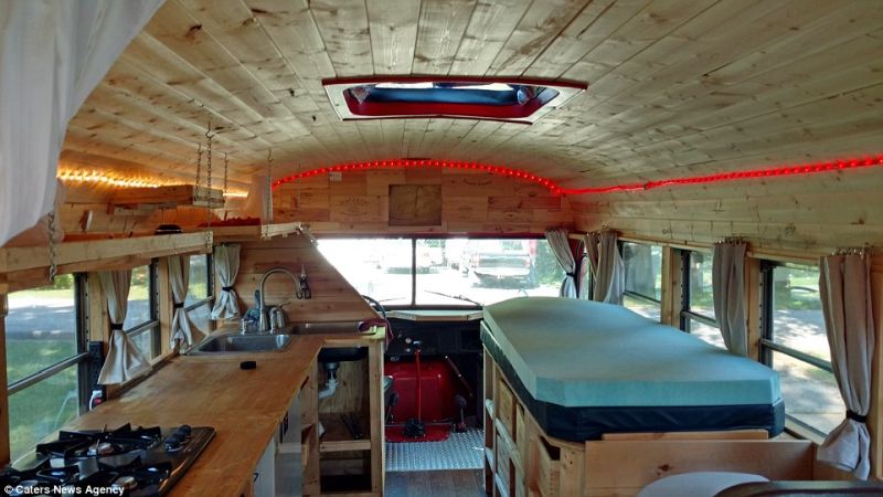 Pipe fitter turned red school bus into a living space on wheels