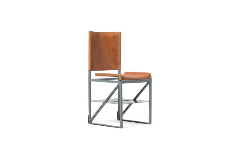 Dark gray chair crafted in powder steel coat with vegetable-tanned leather 