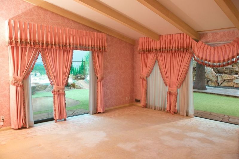 Pink colored drapes in main bedroom 