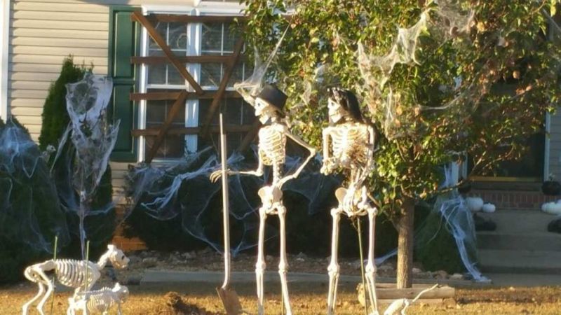 Mr. Bones and his wife gardening in the yard 