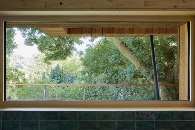 Big horizontal window in the master suite 