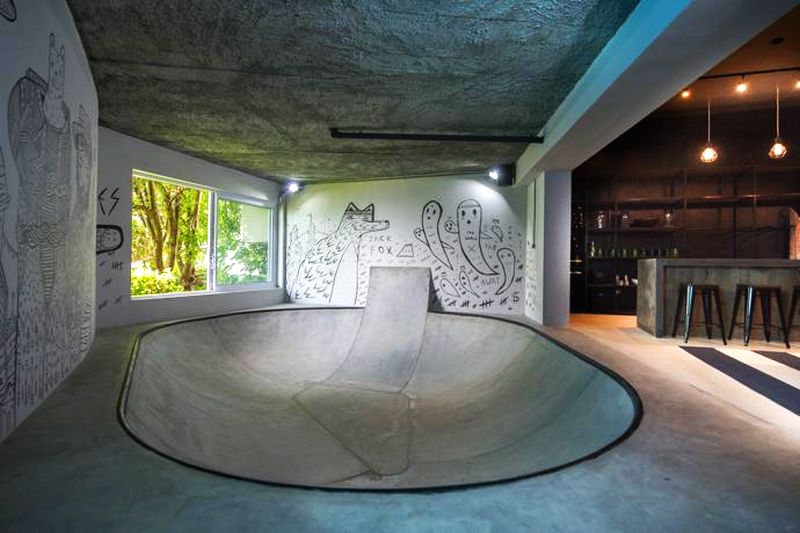 Concrete skating bowl surrounded with amazing street art 