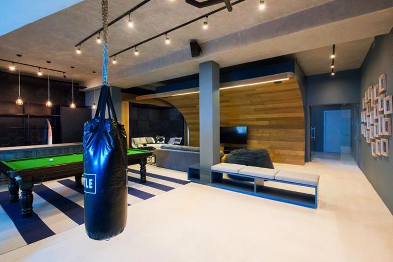 Punching bag next to the bean bag couch 