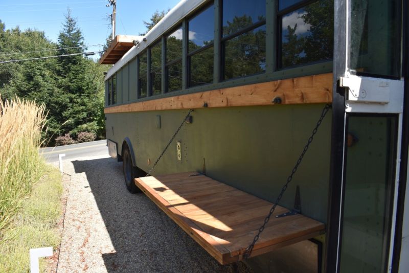 Bus Conversion with fold up outdoor shelf 