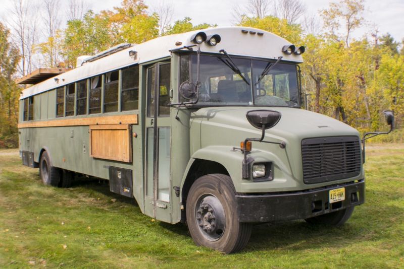 Navigation Nowhere grey Bus Conversion with Rooftop Deck