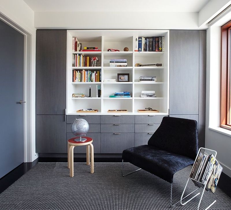 Spacious living room with attractive shelving and mattresses 