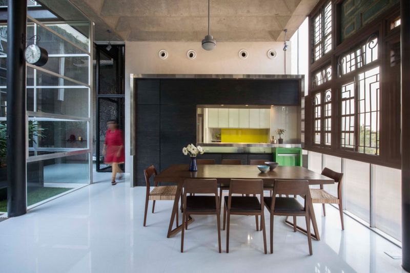 Elegant kitchen with wooden dining table and chairs 