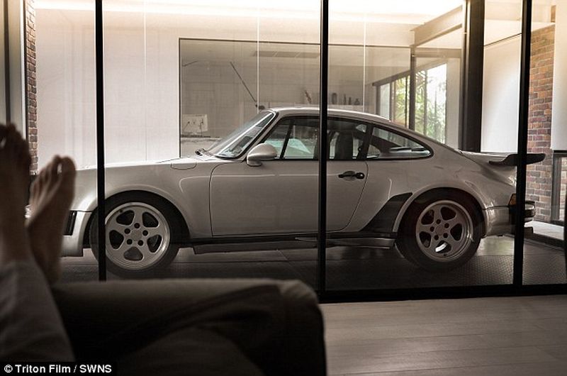 Thai man builds glass elevator in lounge to display his Porsche cars