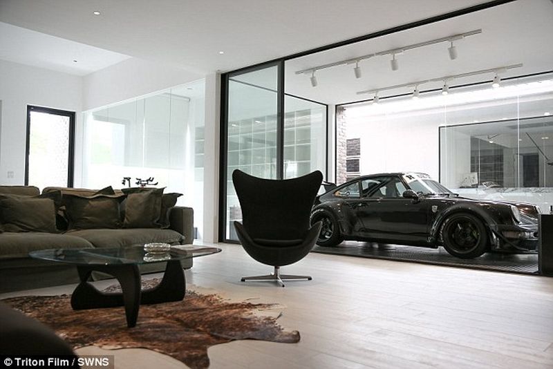 Thai man builds glass elevator in lounge to display his Porsche cars